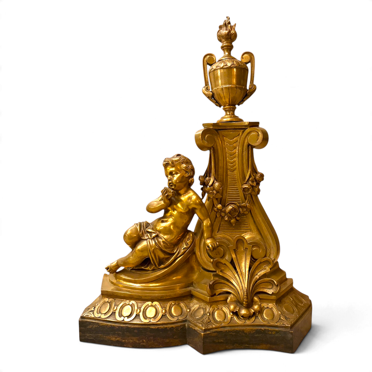 KLS Vaults Louis XVI style gilt-bronze andiron featuring a chased putto, acanthus leaves, and a classical flaming urn.