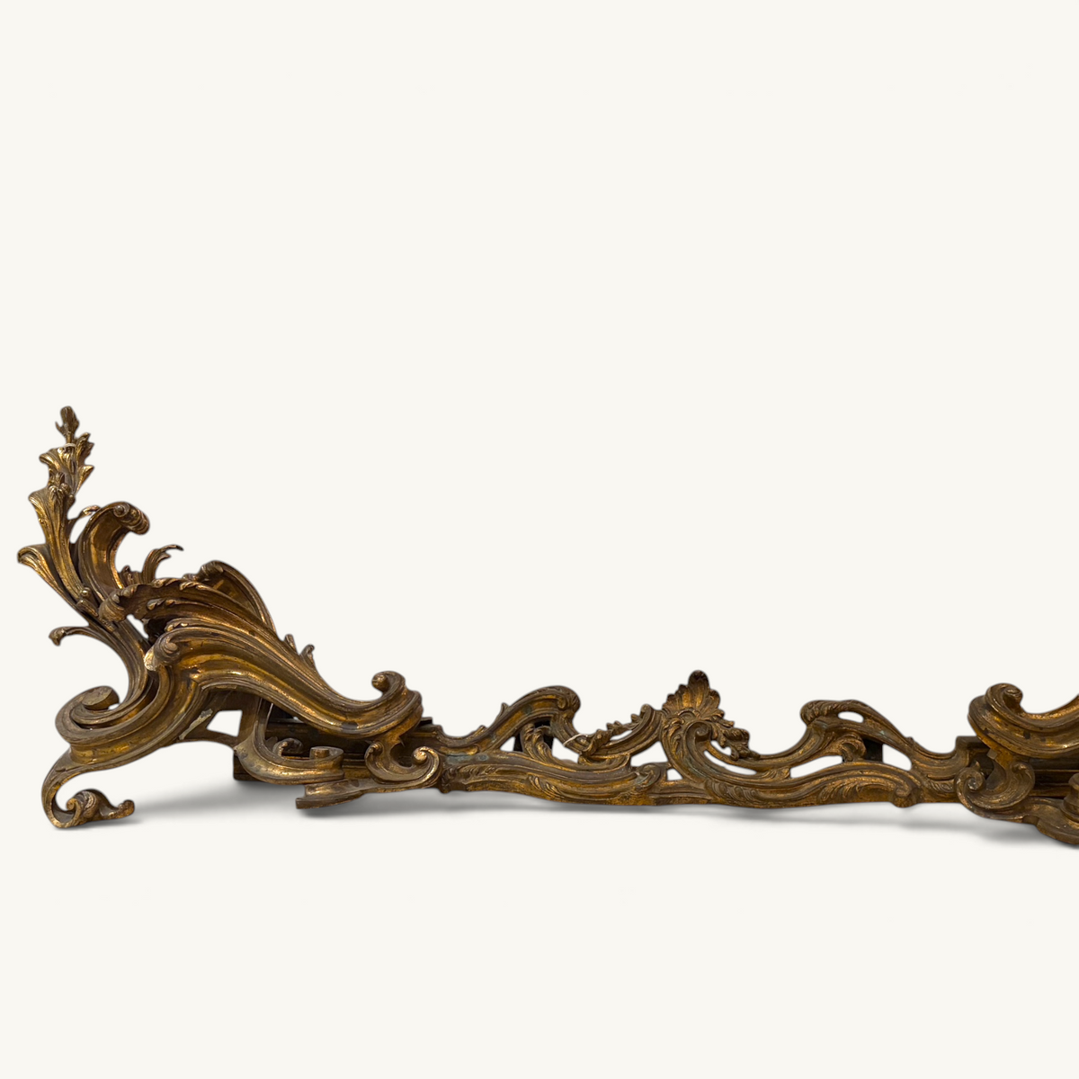 KLS Vaults Louis XV style gilded bronze fireplace fender with intricate Rococo acanthus leaf and C-scroll detailing.