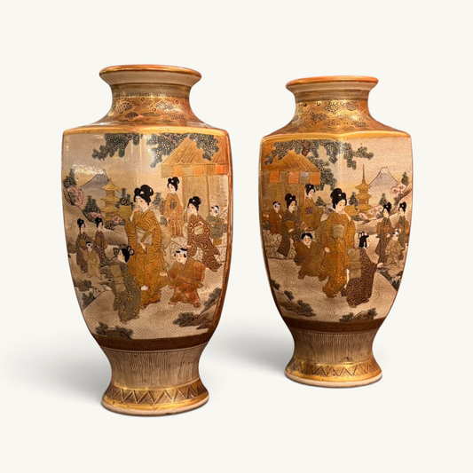 KLS Vaults pair of hexagonal Meiji period Satsuma earthenware vases with intricate polychrome and gilt figural scenes.