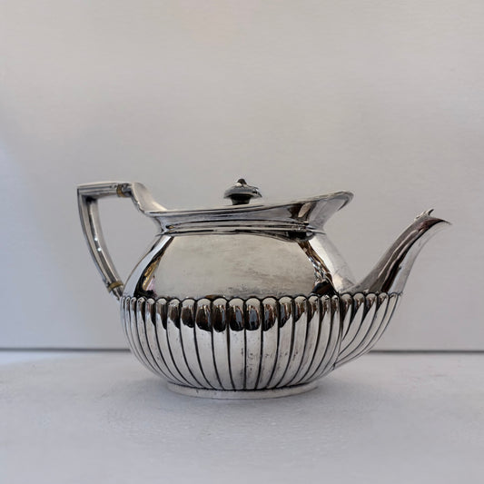 VICTORIAN FLUTED STERLING SILVER TEA SERVICE, LONDON, 1878