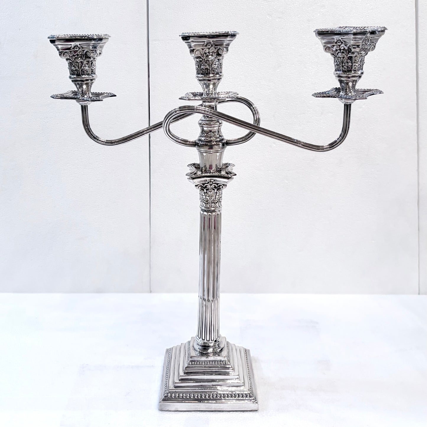 A PAIR OF GEORGE III STYLE CORINTHIAN COLUMN THREE-LIGHT CANDLESTICKS, ENGLISH, 1890