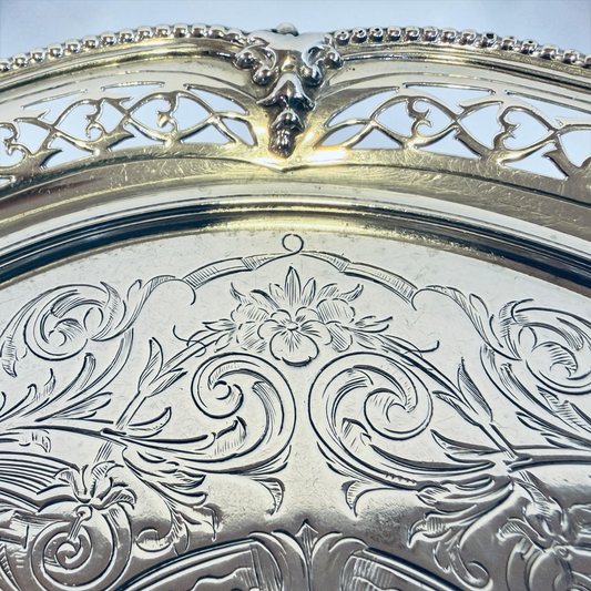 A SMALL VICTORIAN CHASED STERLING SILVER SALVER, LONDON, 1876