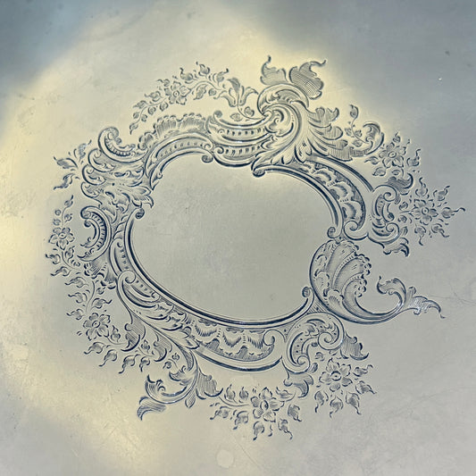 AN ENGRAVED AND GADROONED STERLING SILVER SALVER, LONDON, 1910