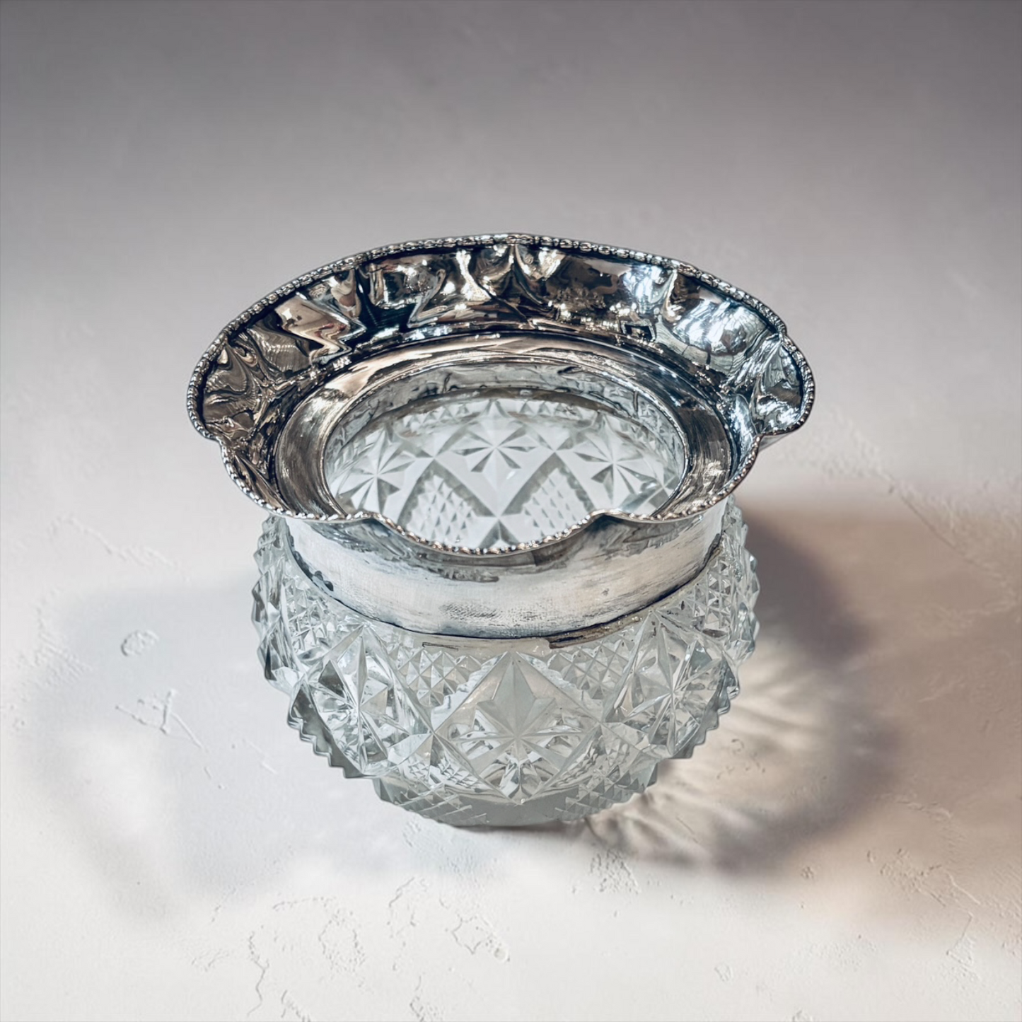 AN EDWARDIAN DIAMOND-CUT SILVER-MOUNTED BOWL, CHESTER, 1907