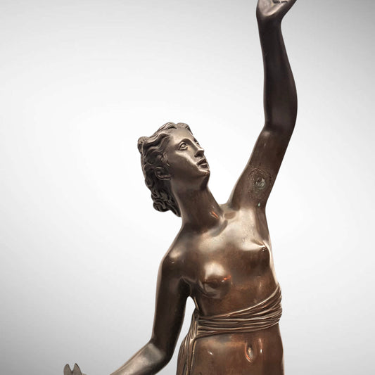 KLS Vaults neoclassical patinated bronze statue of Atropos holding shears, featuring a dynamic upward-reaching pose.