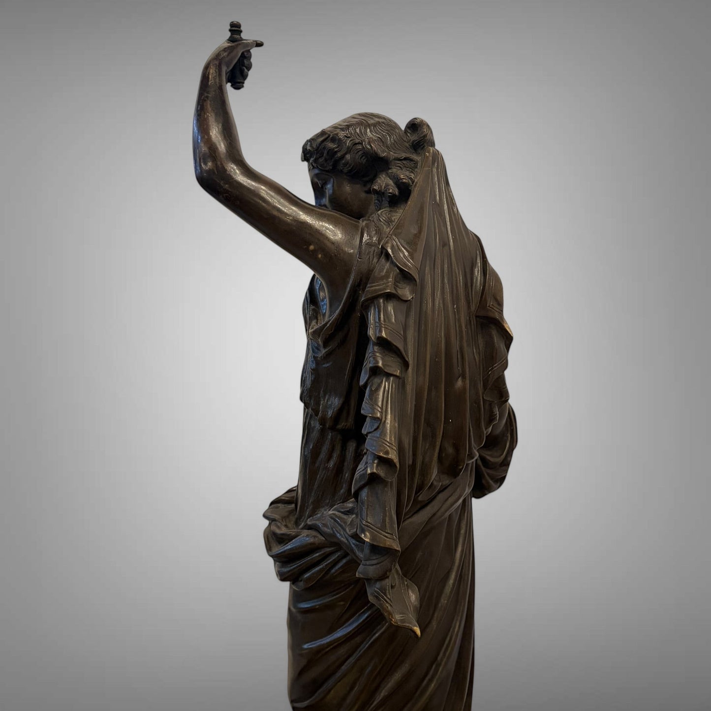 KLS Vaults 19th-century neoclassical patinated bronze figure of Hebe with fluid drapery and dark chocolate patina.