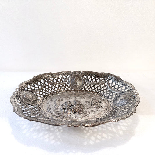 KLS Vaults 19th-century .800 silver reticulated centerpiece with repoussé tavern scene and portrait medallions.