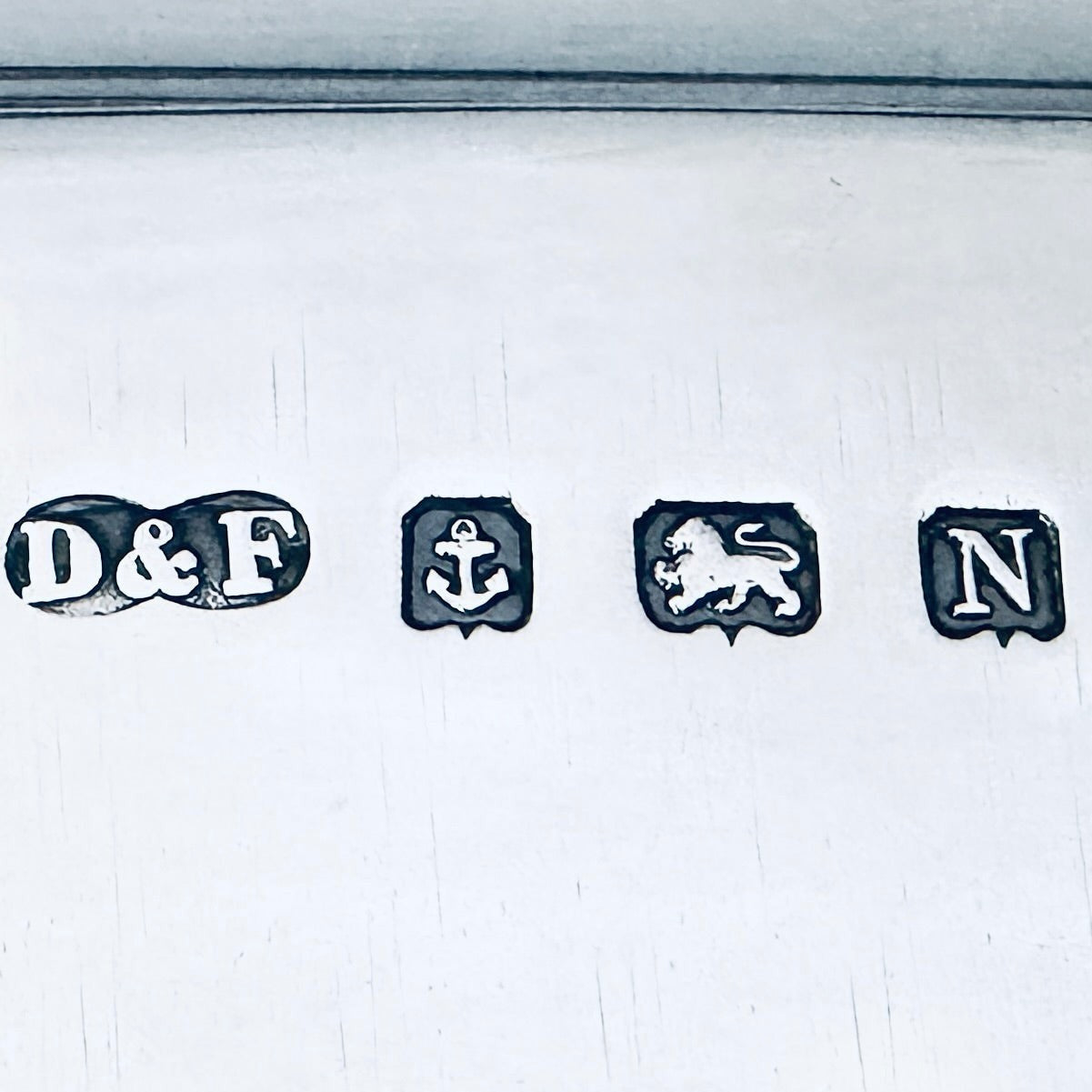 KLS Vaults sterling silver hallmark stamps including D&F maker mark, Birmingham anchor, and lion passant for 1937