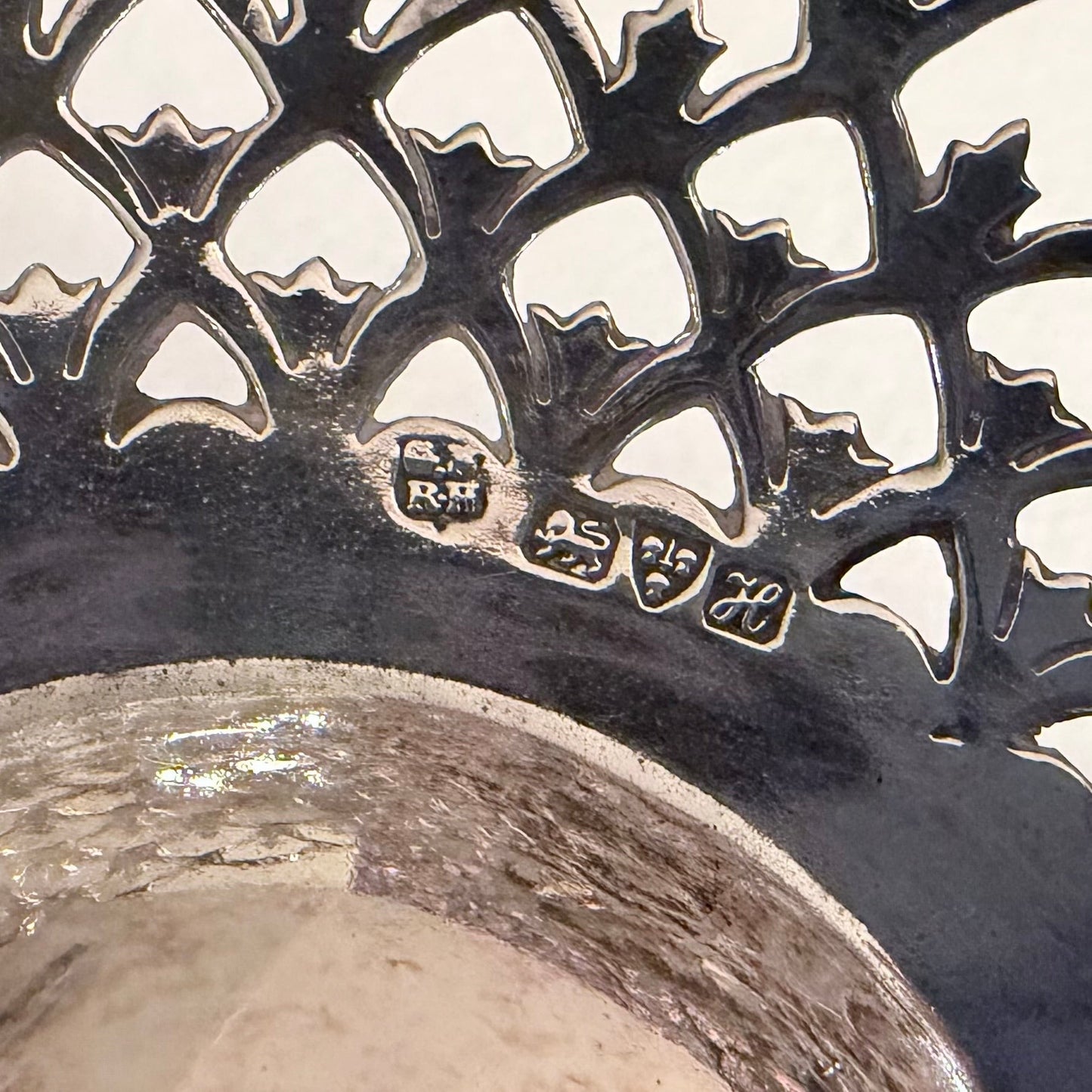 KLS Vaults Edwardian sterling silver epergne showing detailed hallmarks and intricate pierced trellis-work rim.