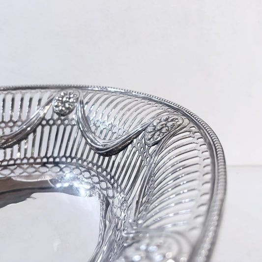KLS Vaults Edwardian sterling silver basket with intricate pierced gallery, scrollwork, and beaded rim detail.