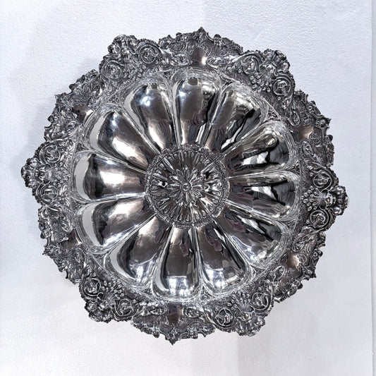 KLS Vaults Victorian sterling silver centerpiece bowl with intricate repoussé floral motifs and scalloped rim.