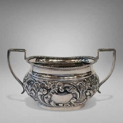 EDWARDIAN REPOUSSÉ STERLING SILVER TEA SERVICE, BIRMINGHAM, 1901