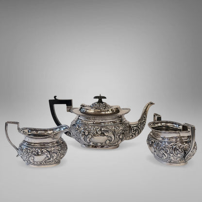 EDWARDIAN REPOUSSÉ STERLING SILVER TEA SERVICE, BIRMINGHAM, 1901