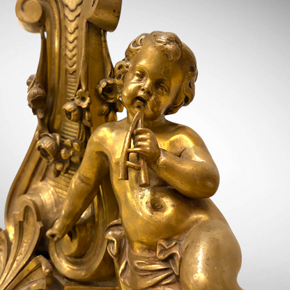 A LOUIS XVI STYLE CHASED AND GILDED FIGURAL ANDIRONS, FRANCE, C. 1870