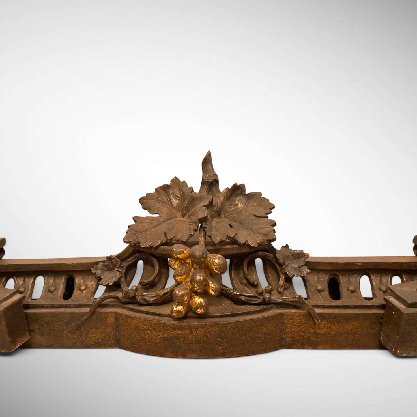 A VICTORIAN PARCEL-GILT BRONZE FIREPLACE FENDER, ENGLAND, C. 1880