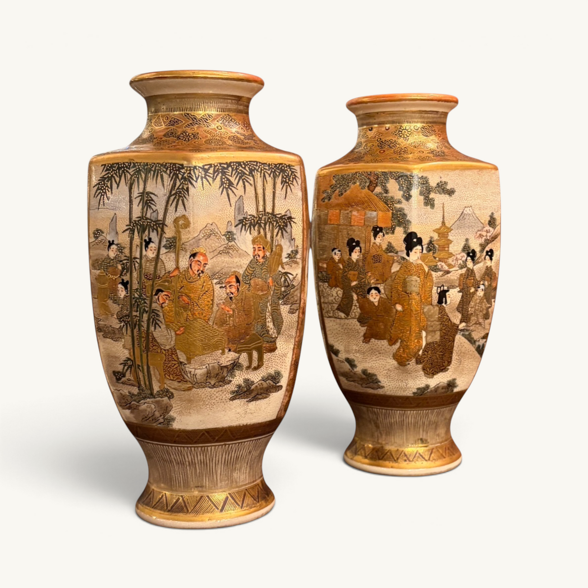 KLS Vaults pair of hexagonal Meiji period Satsuma earthenware vases with intricate polychrome and gilt figural scenes.