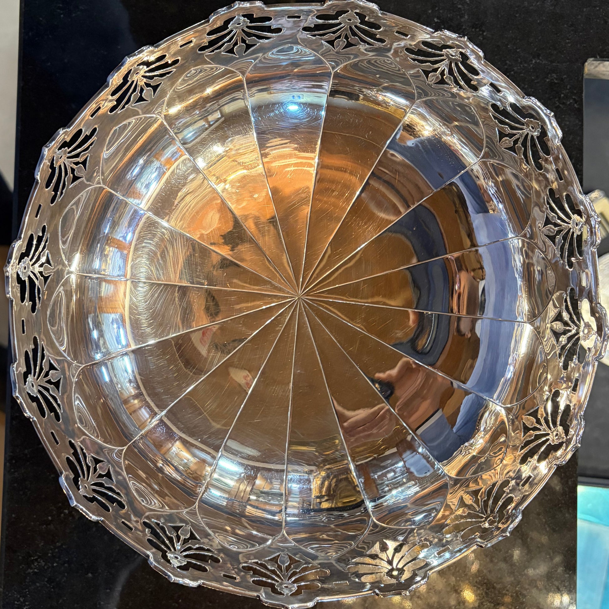 Decorative bowl with intricate designs on a dark surface