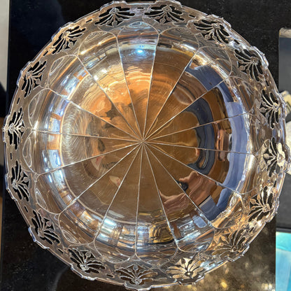 Decorative bowl with intricate designs on a dark surface