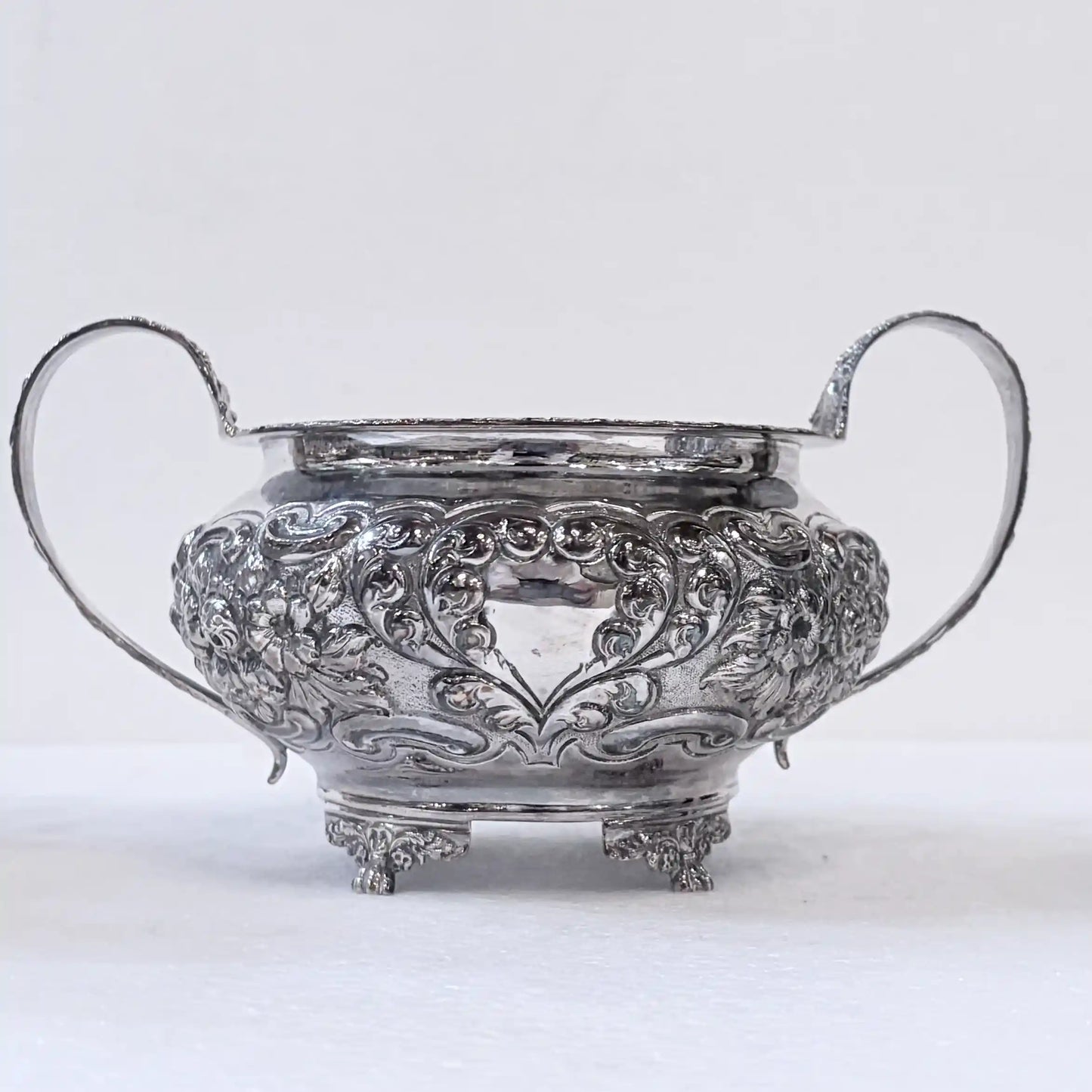 GEORGIAN CHASED SILVER THREE-PIECE TEA SERVICE, LONDON, 1822
