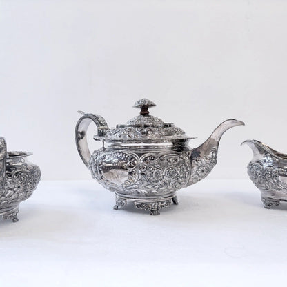 GEORGIAN CHASED SILVER THREE-PIECE TEA SERVICE, LONDON, 1822