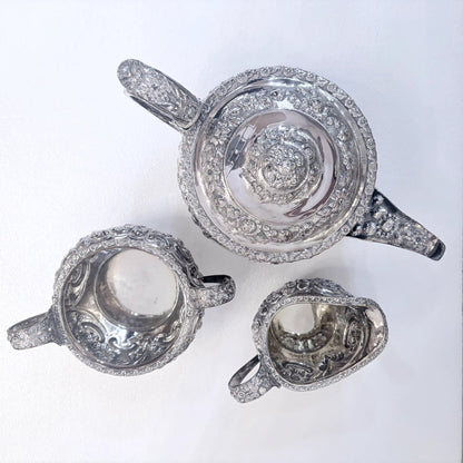 GEORGIAN CHASED SILVER THREE-PIECE TEA SERVICE, LONDON, 1822
