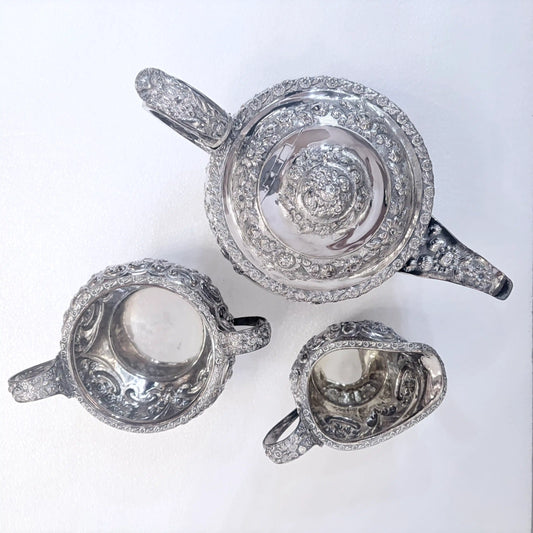 GEORGIAN CHASED SILVER THREE-PIECE TEA SERVICE, LONDON, 1822