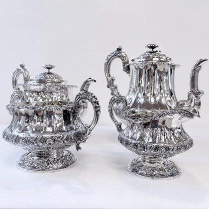 GEORGIAN CHASED AND REPOUSSÉ FOUR PIECE SILVER TEA SERVICE, LONDON, 1824