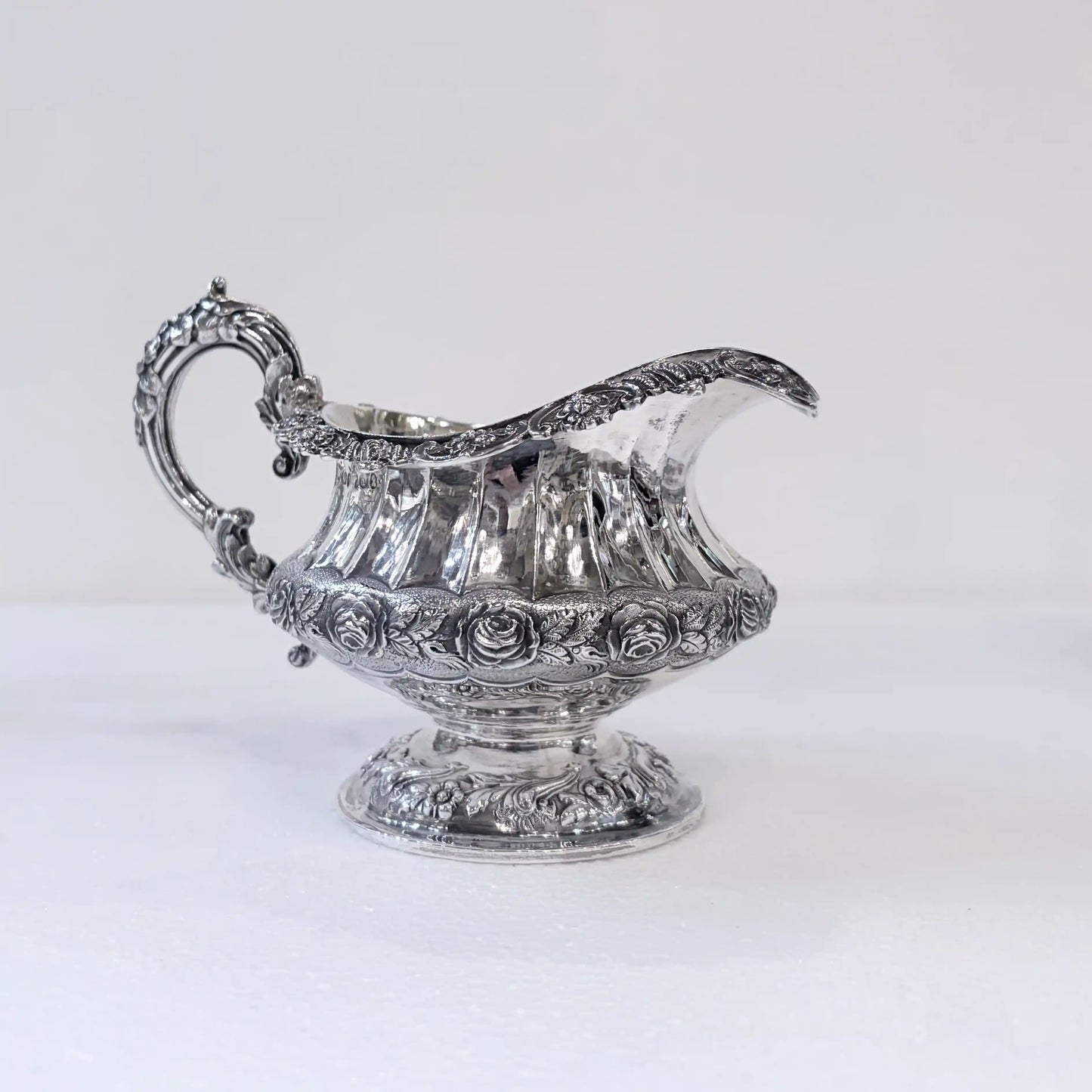 GEORGIAN CHASED AND REPOUSSÉ FOUR PIECE SILVER TEA SERVICE, LONDON, 1824