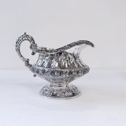 GEORGIAN CHASED AND REPOUSSÉ FOUR PIECE SILVER TEA SERVICE, LONDON, 1824
