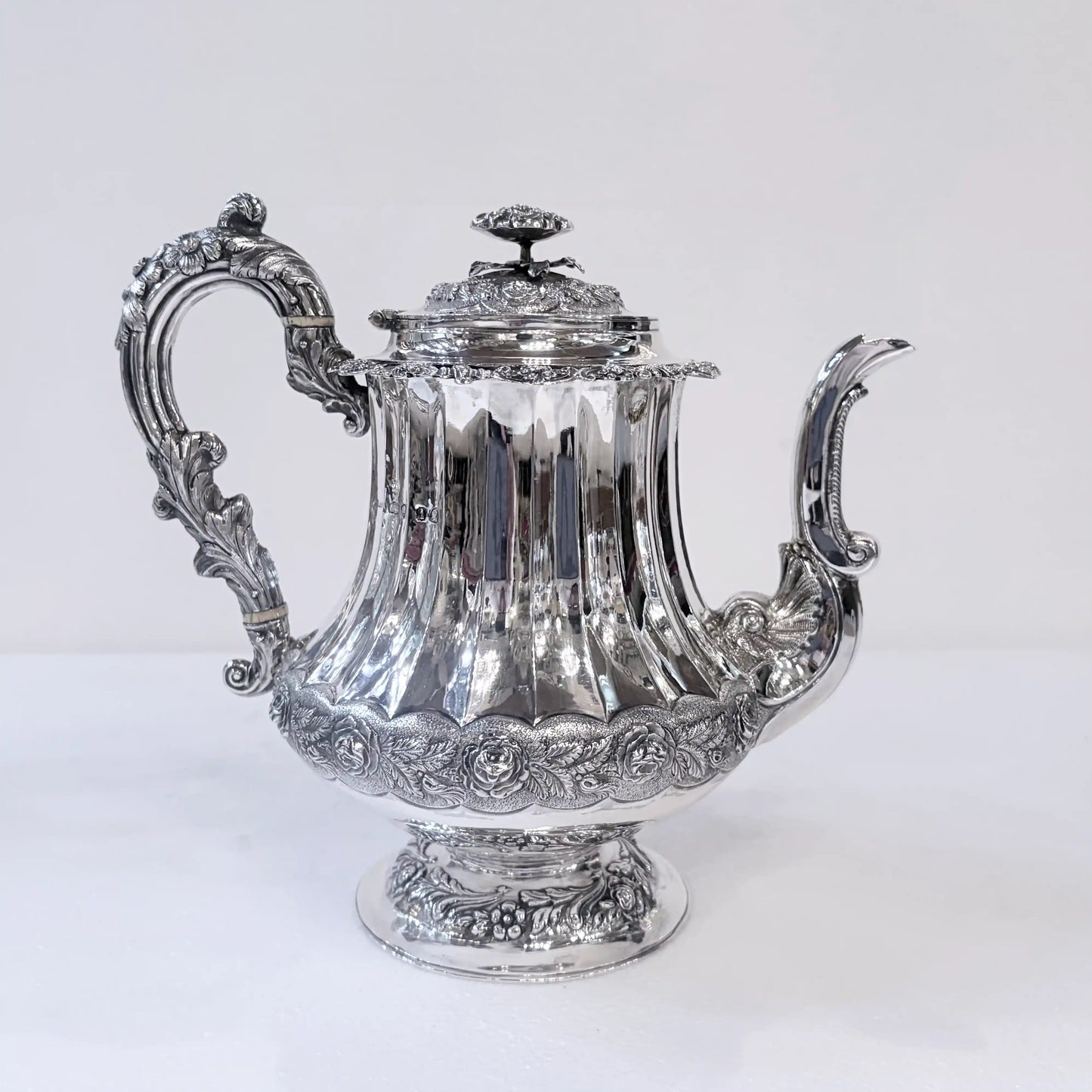 GEORGIAN CHASED AND REPOUSSÉ FOUR PIECE SILVER TEA SERVICE, LONDON, 1824