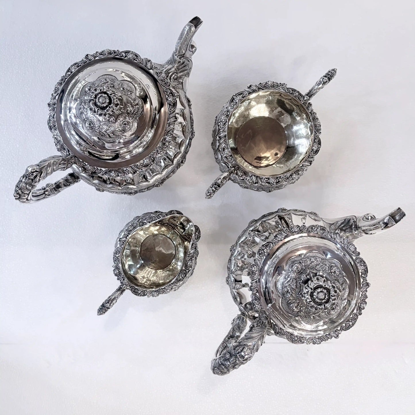 GEORGIAN CHASED AND REPOUSSÉ FOUR PIECE SILVER TEA SERVICE, LONDON, 1824