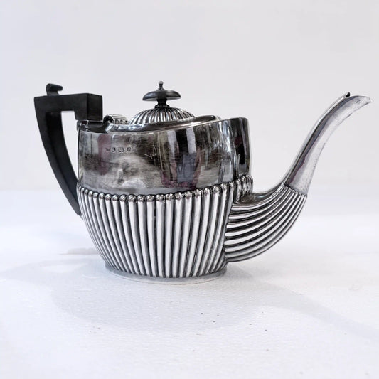 EDWARDIAN GADROONED SILVER MARRIED THREE-PIECE TEA SERVICE, BIRMINGHAM AND SHEFFIELD, 1904-1916