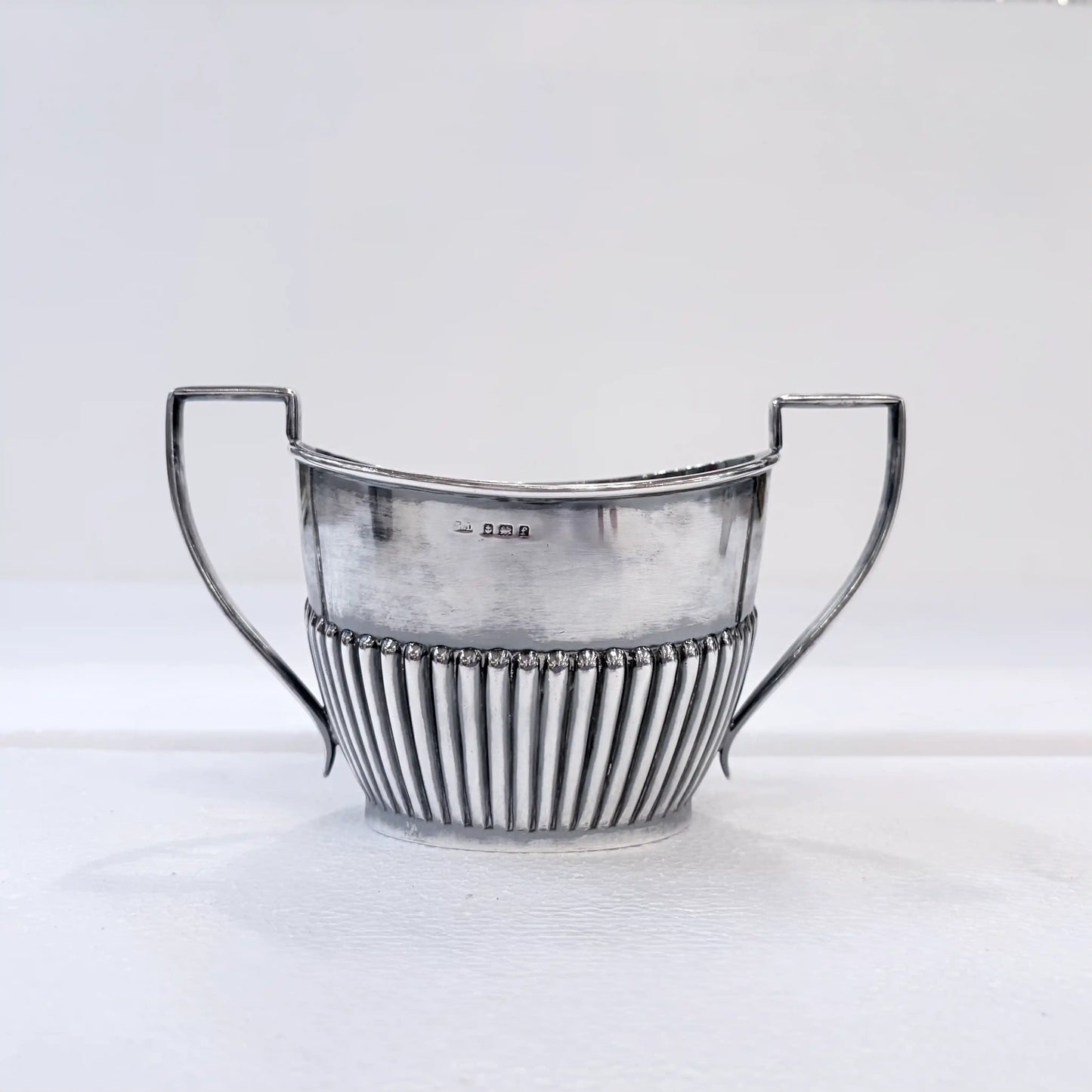 EDWARDIAN GADROONED SILVER MARRIED THREE-PIECE TEA SERVICE, BIRMINGHAM AND SHEFFIELD, 1904-1916