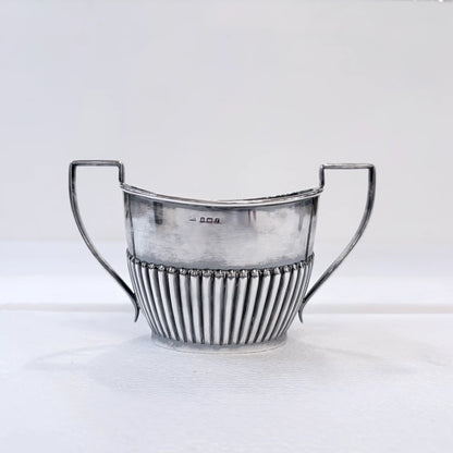 EDWARDIAN GADROONED SILVER MARRIED THREE-PIECE TEA SERVICE, BIRMINGHAM AND SHEFFIELD, 1904-1916