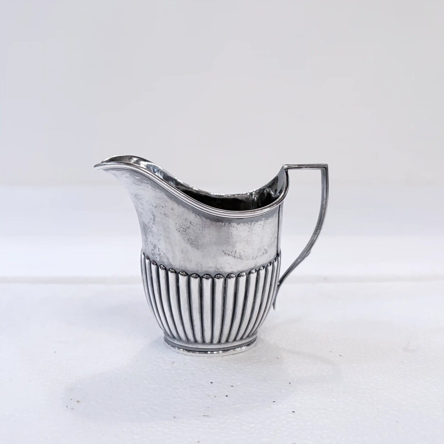 EDWARDIAN GADROONED SILVER MARRIED THREE-PIECE TEA SERVICE, BIRMINGHAM AND SHEFFIELD, 1904-1916