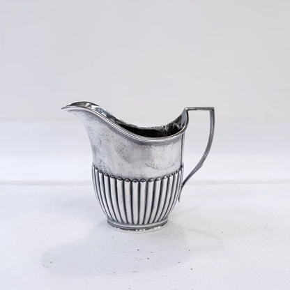 EDWARDIAN GADROONED SILVER MARRIED THREE-PIECE TEA SERVICE, BIRMINGHAM AND SHEFFIELD, 1904-1916