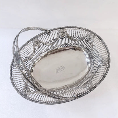EDWARDIAN PIERCED STERLING SILVER SWING-HANDLED BASKET, LONDON, 1912
