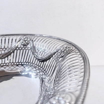 EDWARDIAN PIERCED STERLING SILVER SWING-HANDLED BASKET, LONDON, 1912