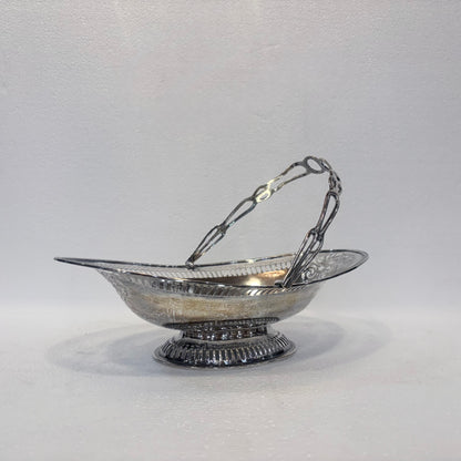 EDWARDIAN PIERCED STERLING SILVER SWING-HANDLED BASKET, BIRMINGHAM, 1905