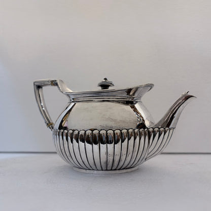 VICTORIAN FLUTED STERLING SILVER TEA SERVICE, LONDON, 1878