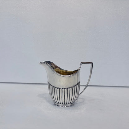 VICTORIAN FLUTED STERLING SILVER TEA SERVICE, LONDON, 1878