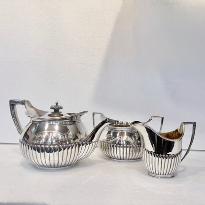 VICTORIAN FLUTED STERLING SILVER TEA SERVICE, LONDON, 1878