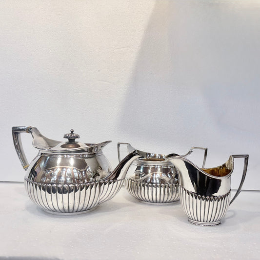 VICTORIAN FLUTED STERLING SILVER TEA SERVICE, LONDON, 1878