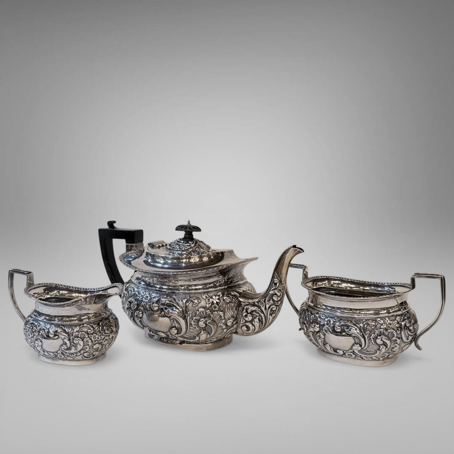 EDWARDIAN REPOUSSÉ STERLING SILVER TEA SERVICE, BIRMINGHAM, 1901