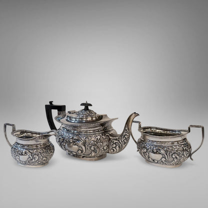 EDWARDIAN REPOUSSÉ STERLING SILVER TEA SERVICE, BIRMINGHAM, 1901