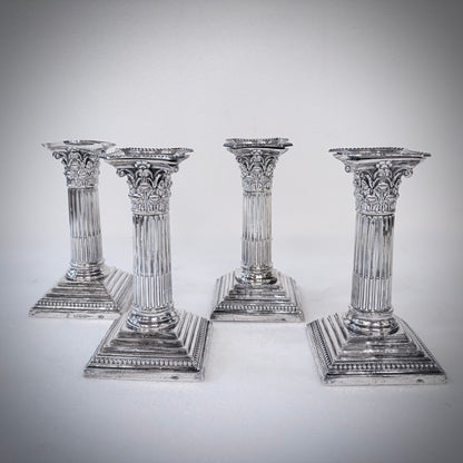 SET OF FOUR LATE VICTORIAN CORINTHIAN COLUMN STERLING SILVER CANDLESTICKS, LONDON, 1893