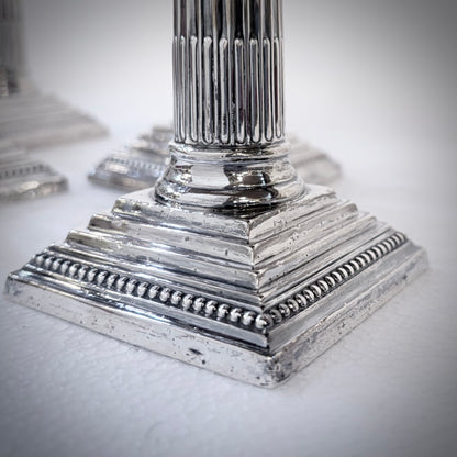 SET OF FOUR LATE VICTORIAN CORINTHIAN COLUMN STERLING SILVER CANDLESTICKS, LONDON, 1893