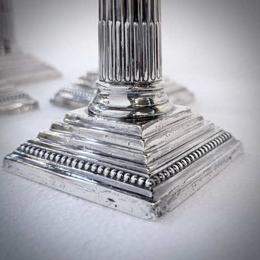 SET OF FOUR LATE VICTORIAN CORINTHIAN COLUMN STERLING SILVER CANDLESTICKS, LONDON, 1893