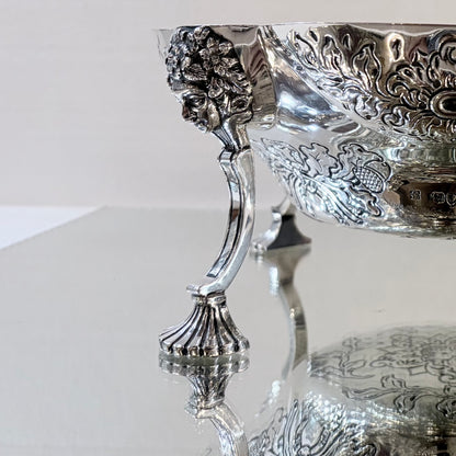 A PAIR OF LATE VICTORIAN REPOUSSÉ STERLING SILVER CENTERPIECES, LONDON, 1889