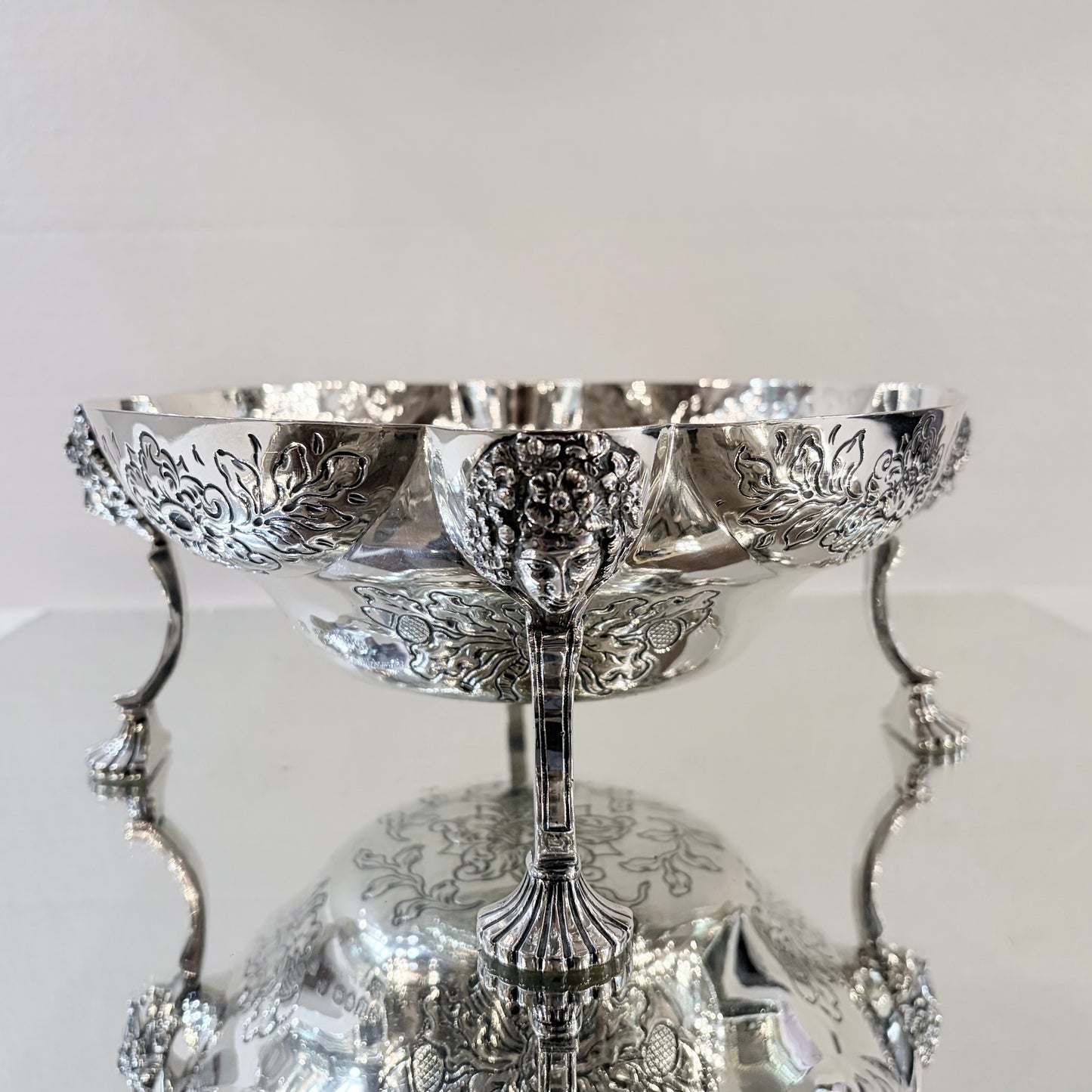 A PAIR OF LATE VICTORIAN REPOUSSÉ STERLING SILVER CENTERPIECES, LONDON, 1889
